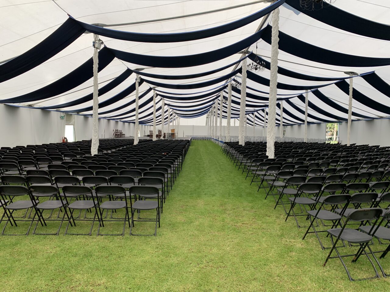 90ft Showspan with Navy blue ceiling drapes and flat white wall lining for Oundle School Speech Day 2019
School Graduation