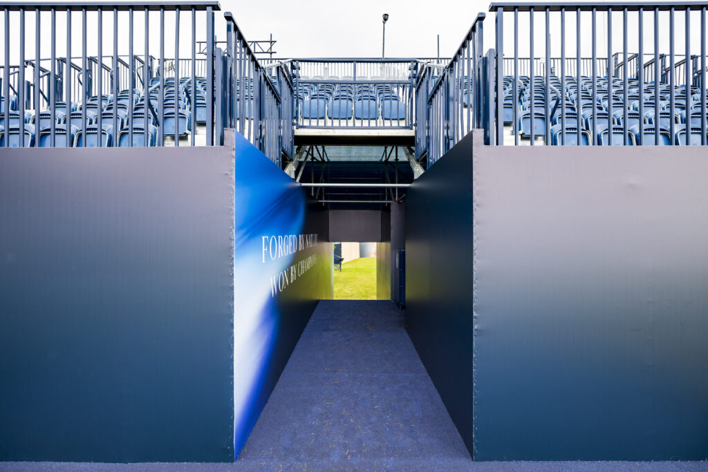 Temporary tiered seating and players entryway at the 1st tee, Royal Troon. Horseshoe grandstand designed and delivered by GL events UK
